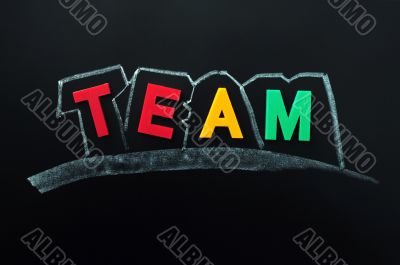 Team on a blackboard