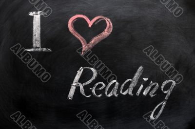 I love reading - text written on a blackboard