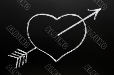 Heart with Cupid`s arrow hitting through