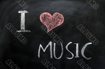 I love music - text written on a blackboard