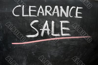 Clearance sale written on a blackboard
