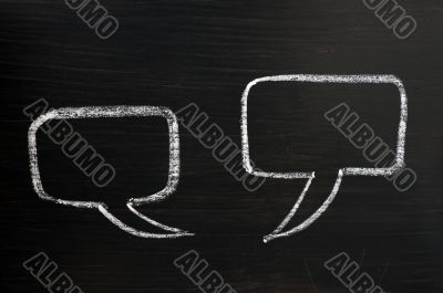 Two speech bubbles on a blackboard