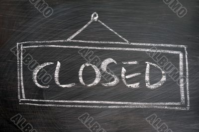Closed - word written on blackboard