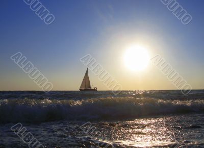 Lonely sail drifting by the sea summertime