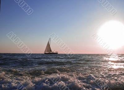 Lonely sail drifting by the sea summertime