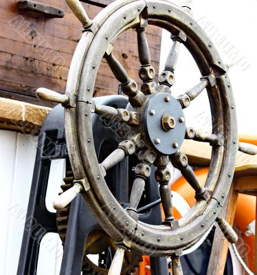 Close up of a steering wheel of the ship 