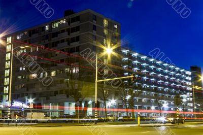 traffic through modern city at night in Amsterdam