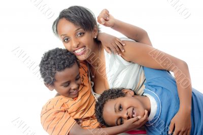 Two young boy playing with their their big sister