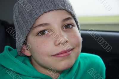 closeup of cute young teen boy in  gray hat