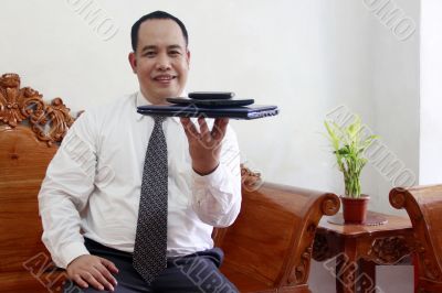 Businessman with gadget on his hand