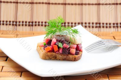 Sandwiches with rye bread, herring and vegetables