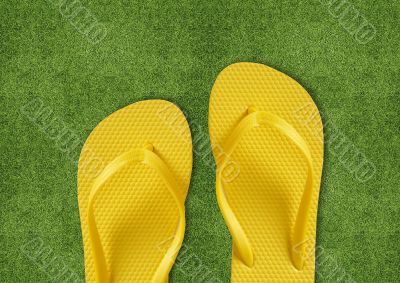 Yellow Flip Flops on green grass