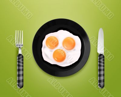 Three fried eggs on a Plate