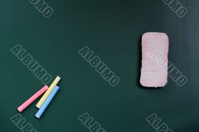 Blank blackboard with eraser and chalk