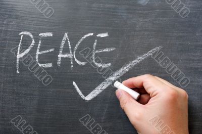 Peace - word written on a blackboard