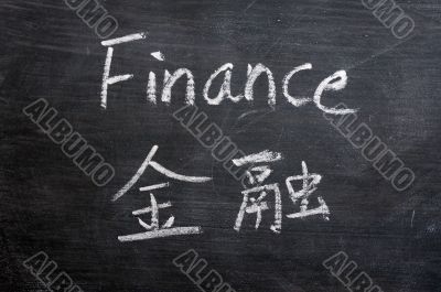 Finance - word written on a smudged blackboard