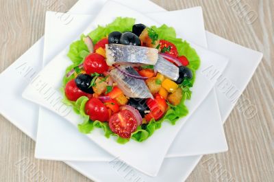 Appetizer of herring and vegetables with croutons