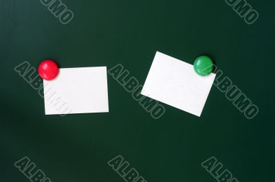 Blank stick note on a green board