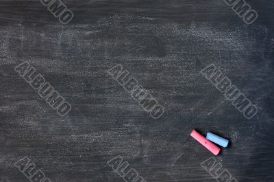Smudged blackboard background with chalk and copy space