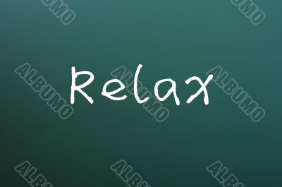 Relax - word written on a blackboard