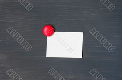 Blank stick note on a blackboard