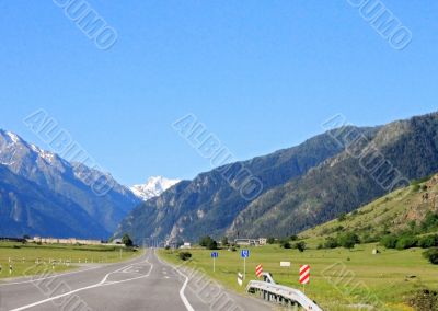 Road leading between the mountains. Caucasus travel