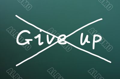 Do not give up, words written on blackboard 