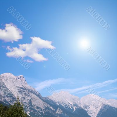 white clouds and blue sky in the mountain country