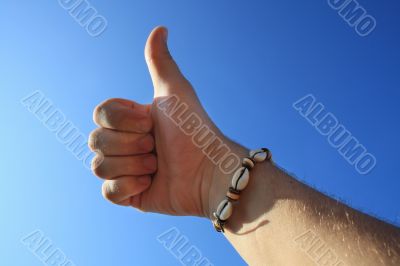 male hand thumbs up