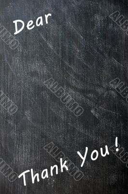 Thank you written with chalk on blackboard with copy space for extra text 