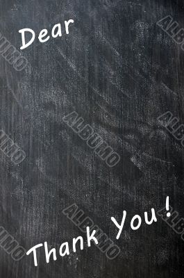 Thank you written with chalk on blackboard with copy space for extra text Thank you written with chalk on blackboard with copy space for extra text