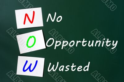 Acronym of NOW - No Opportunity Wasted on a chalkboard 