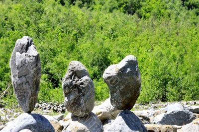 Balanced stones near the caucasus mountain river