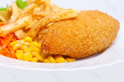 Chicken Kiev with corn and french fries Chicken Kiev with corn and french fries