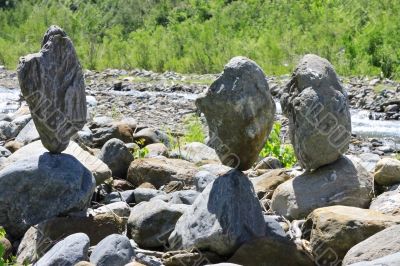 Balanced stones near the caucasus mountain river