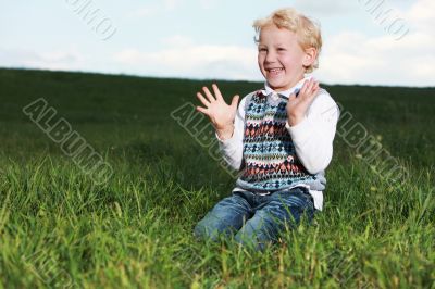 Little boy clapping his hands in glee
