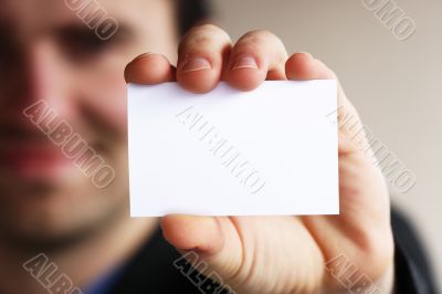 Businessman shows business card