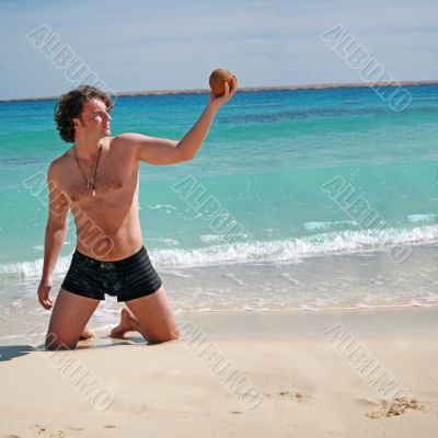 Man posing with the coconut in hand