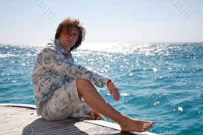 Man posing on the yacht