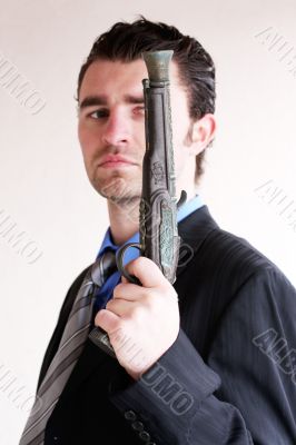 Businessman with ancient weapon