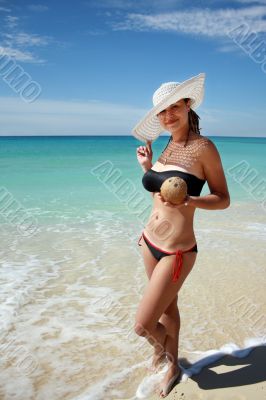 Woman holding coconut in hand