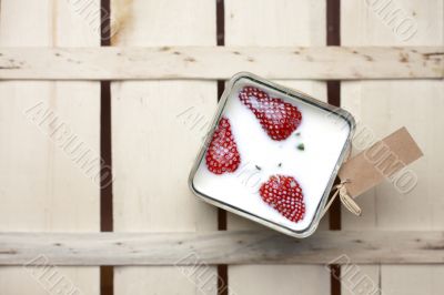 Strawberries floating in milk