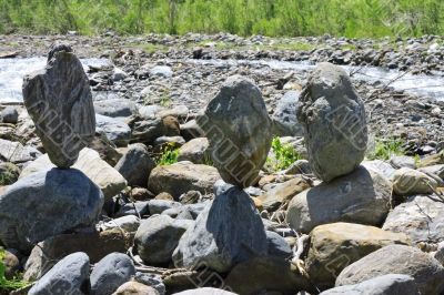 Balanced stones near the caucasus mountain river