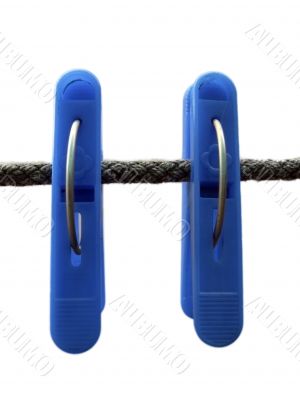 Blue clothes peg and string on the white background isolated