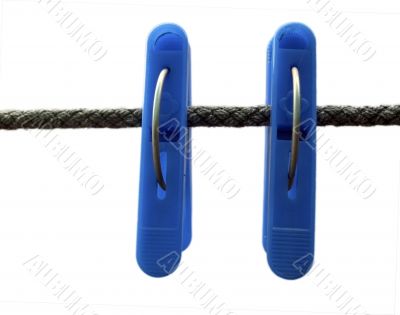 Blue clothes peg and string on the white background isolated