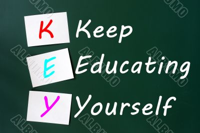 KEY acronym -Keep educating yourself on a blackboard with sticky notes