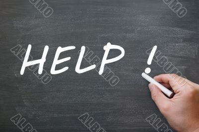Help written with chalk on a blackboard background Help written with chalk on a blackboard background