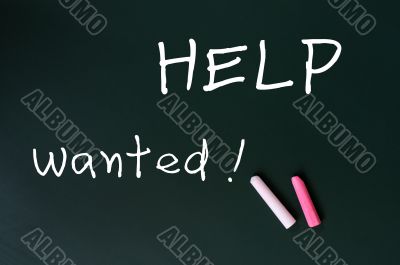 Help wanted - written with chalk on a green chalkboard background