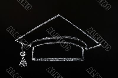 Trencher cap drawn with chalk on blackboard background