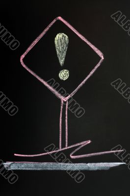 Exclamation mark sign drawn on a blackboard background